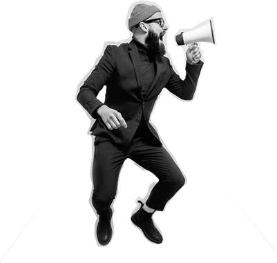 Ein bärtiger Mann im Anzug der hochspringt